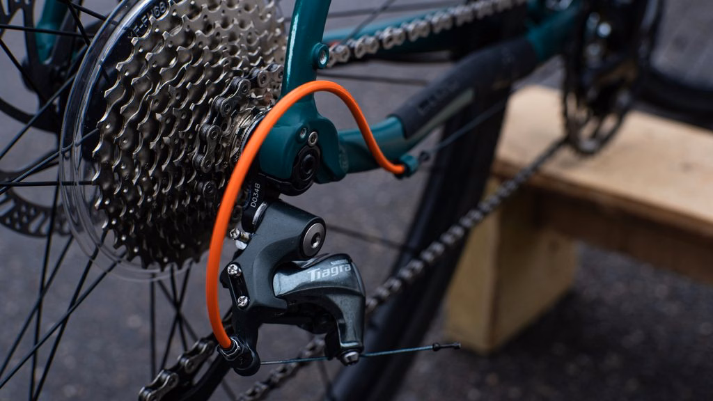 Mountain Bike Drivetrain Review: image of a cable-connected rear derailleur